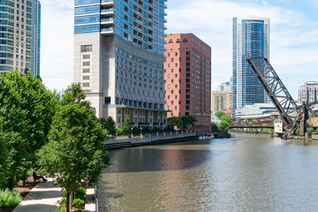 The Chicago River and Riverwalk looking towards the Raised Kinzie Street Railway Bridge with Skyscrapers