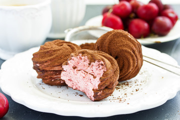 Homemade marshmallows with cherries and chocolate.