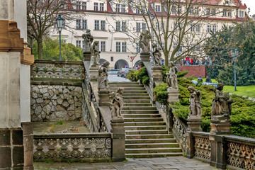 Stairs with sculptures in The Prague Loreta. Prague. Czech Republic.