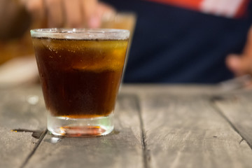 Cool iced soft drink cola carbonated liquid fresh food with soda water in clear glass.