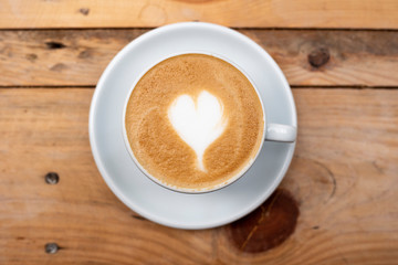 latte art heart on wood table