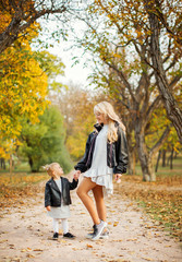 Mother with child outdoors.