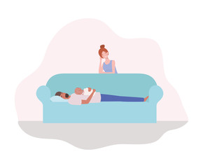 parents taking care of newborn baby in the couch