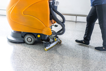 cleaning floor with machine
