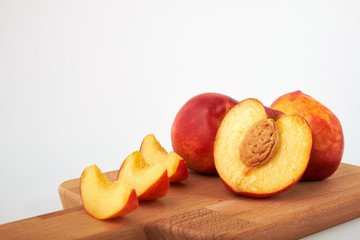 Ripe juicy nectarines isolated on white background