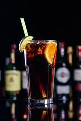 classic cocktail cuba libre with ice and close-up in a cuban bar