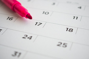 calendar page with red pen close up