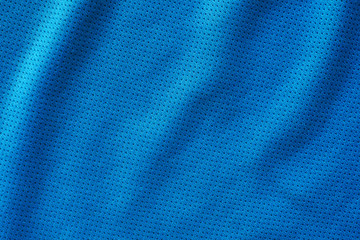 Blue fabric sport clothing football jersey with air mesh texture background