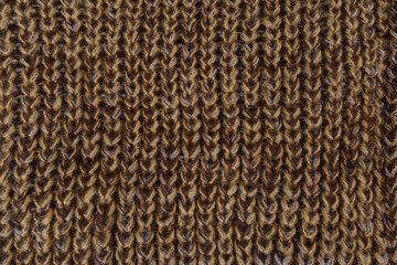 Brown knitted texture fragment. Handmade women hobby