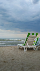 two chairs on the beach. Summer sea sunset landscape. 