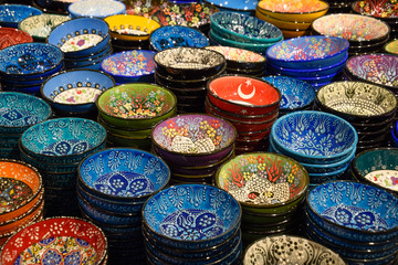 Painted beautiful dishes on the counter.