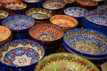 Painted beautiful dishes on the counter.