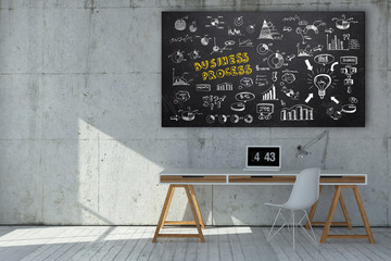 Modern minimalist workstation with business doodles sketched on a blackboard above a small neat...