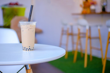 Milk bubble tea in takeaway glass, Homemade Milk Tea with Tapioca Pearls with copy space,  selective focus.