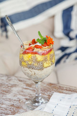 Chia pudding with strawberry, mango and sliced almonds, healthy delicious breakfast option
