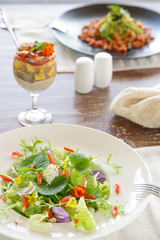 Healthy organic vegetarian food served on the restaurant table.