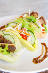 Spanish finger food. Tacos with meat and vegetables
