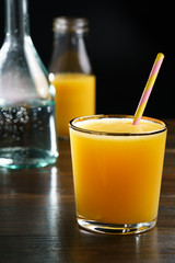 Orange juice and soda (schorle) in a tumbler glass