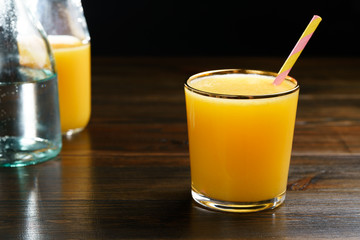 Orange juice and soda (schorle) in a tumbler glass