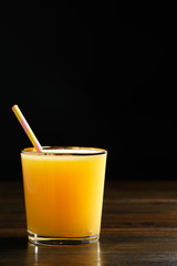 Orange juice and soda (schorle) in a tumbler glass