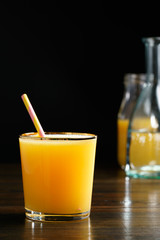 Orange juice and soda (schorle) in a tumbler glass