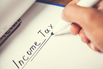 income tax text on paper