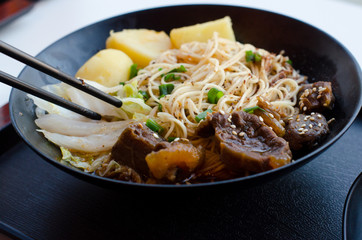 Closeup of a bowl of beef and vegetable stir fry.