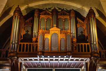 Interior view of the massive pipe organ inside the Rosary Basilica in Lourdes, France