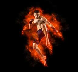 Fototapeta na wymiar MMA male fighter kick. Flames background