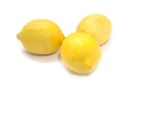 Three lemons on a light background.