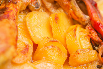 Closeup to Potatoes with Chicken cooked