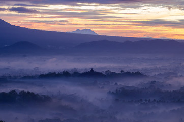 Fototapeta na wymiar foggy morning Borobudur Budhist Temple java Indonesia