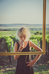 little girl behind frame
