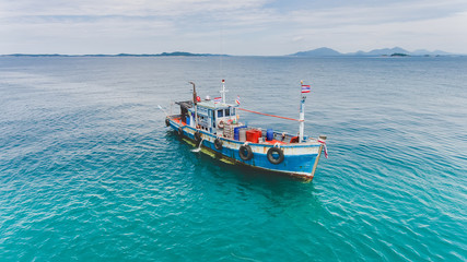 Naklejka na ściany i meble Top view from sky group of wooden fishery boat.