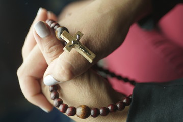 rosary in women's hands