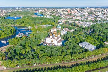 Fototapeta na wymiar Scenic aerial view of old the Assumption Cathedral in ancient touristic town Yaroslavl in Russian Federation. Beautiful summer sunny look of big orthodox cathedral in historical center of russian city