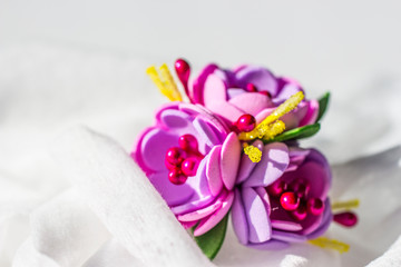 Flowers made by hand from foamiran for decoration.