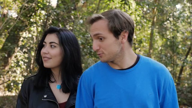 Young woma Refusing Mans Kiss during first date in the park.Friend zone,refusal