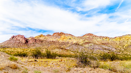 Obraz na płótnie Canvas Colorful and Rugged Mountains along highway SR 165 in El Dorado Canyon on the border of Nevada and Arizona. The canyon is part of the Lake Mead National Recreation Area in the USA