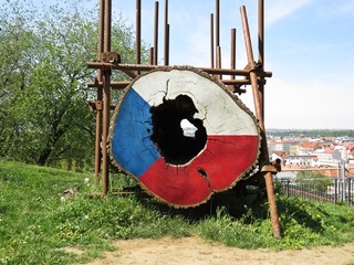 View from Vitkov Hill at Prague Castle Through Hole in a Tree Trunk Log