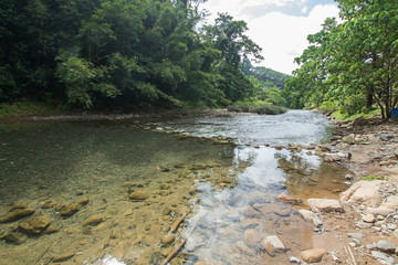 Ton Kloi Waterfall ,in the forest at Ban Siam,Ranong,Thailand. Used in editing.Create a graphic,Creative travel business