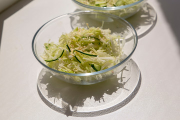 Fresh vegetable salad in transparent plates