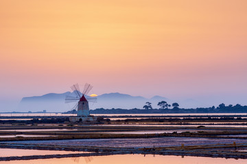 Sunset at the old saltworks in the Laguna dello Stagnone near Trapani, Sicily, Italy © Kim