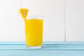 Pineapple juice with piece of fruit