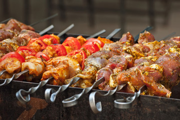 Barbecue fries in the coals. Meat and beef at the field kitchen festival.