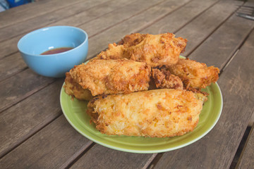 The sauce chicken,On a brown wood table,In Phuket Thailand