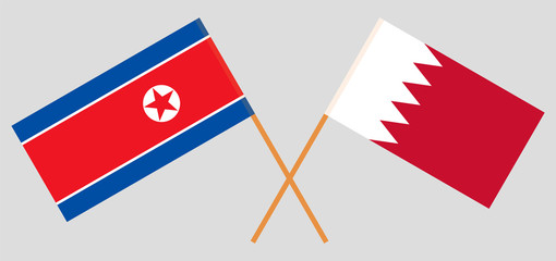 Bahrain and North Korea. Crossed Bahraini and Korean flags