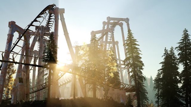 old roller coaster at sunset in forest