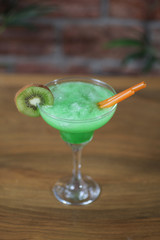 blue cocktail with lime and mint