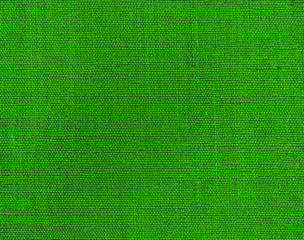 Textured background of green natural textile   
